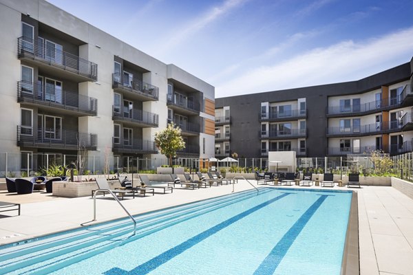 Luxurious pool with lounging area at Talaria Apartments, Greystar luxury community in Burbank