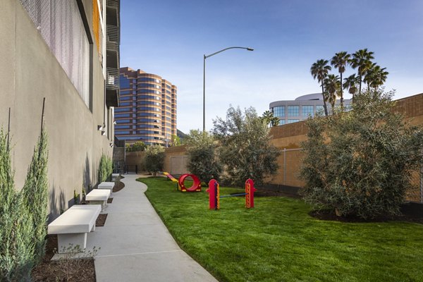 Outdoor dog run with agility equipment at Talaria Apartments, providing a pet-friendly amenity for residents to enjoy with their furry companions