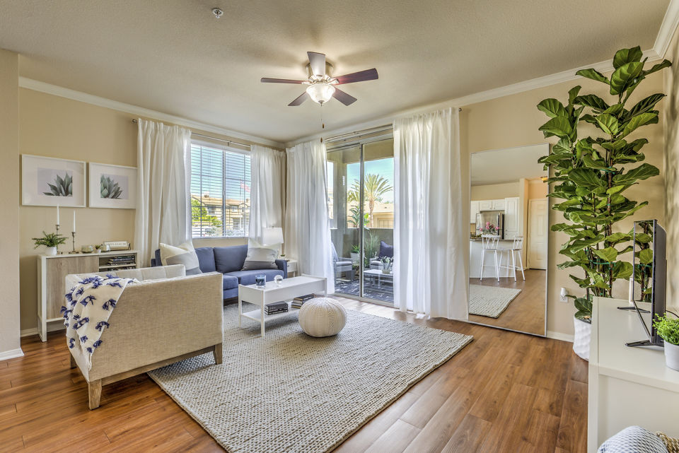 **Spacious living room with stylish decor and ample natural light at The Paseo at Town Center luxury apartments**