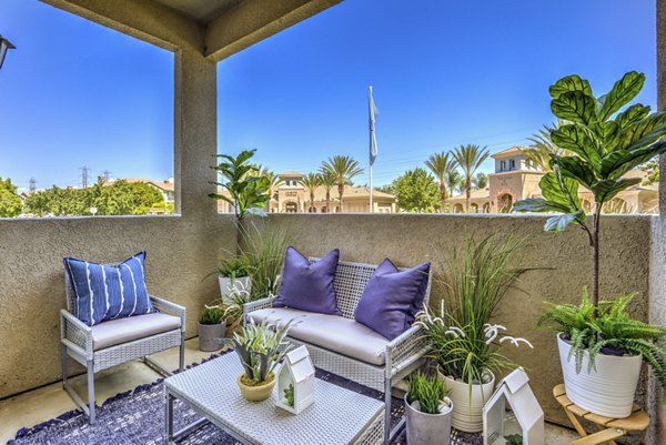 The Paseo at Town Center: Cozy patio with modern seating and lush greenery, ideal for relaxation and outdoor gatherings in a luxury setting