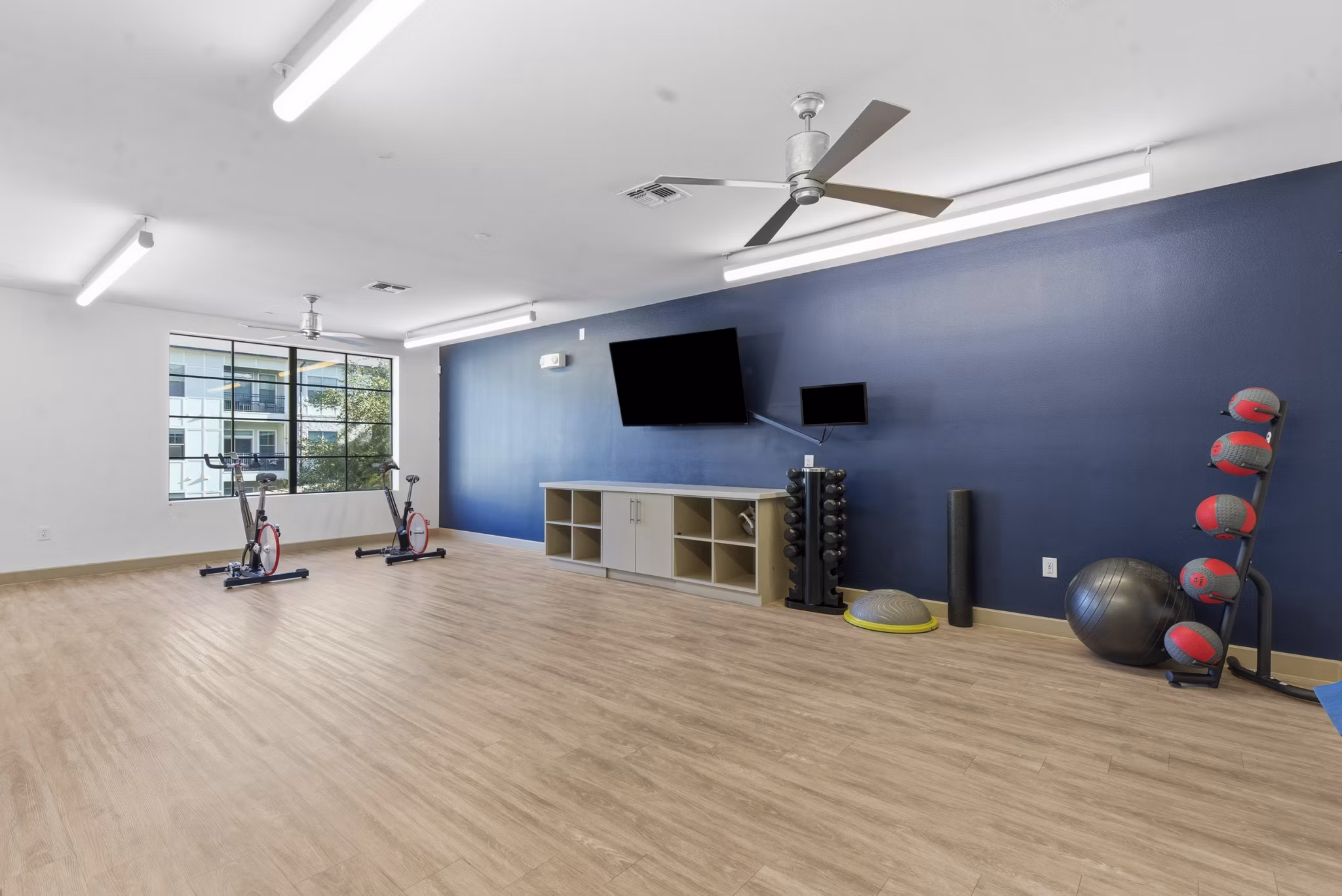 fitness center at The Sterling at Oak Hills Apartments
