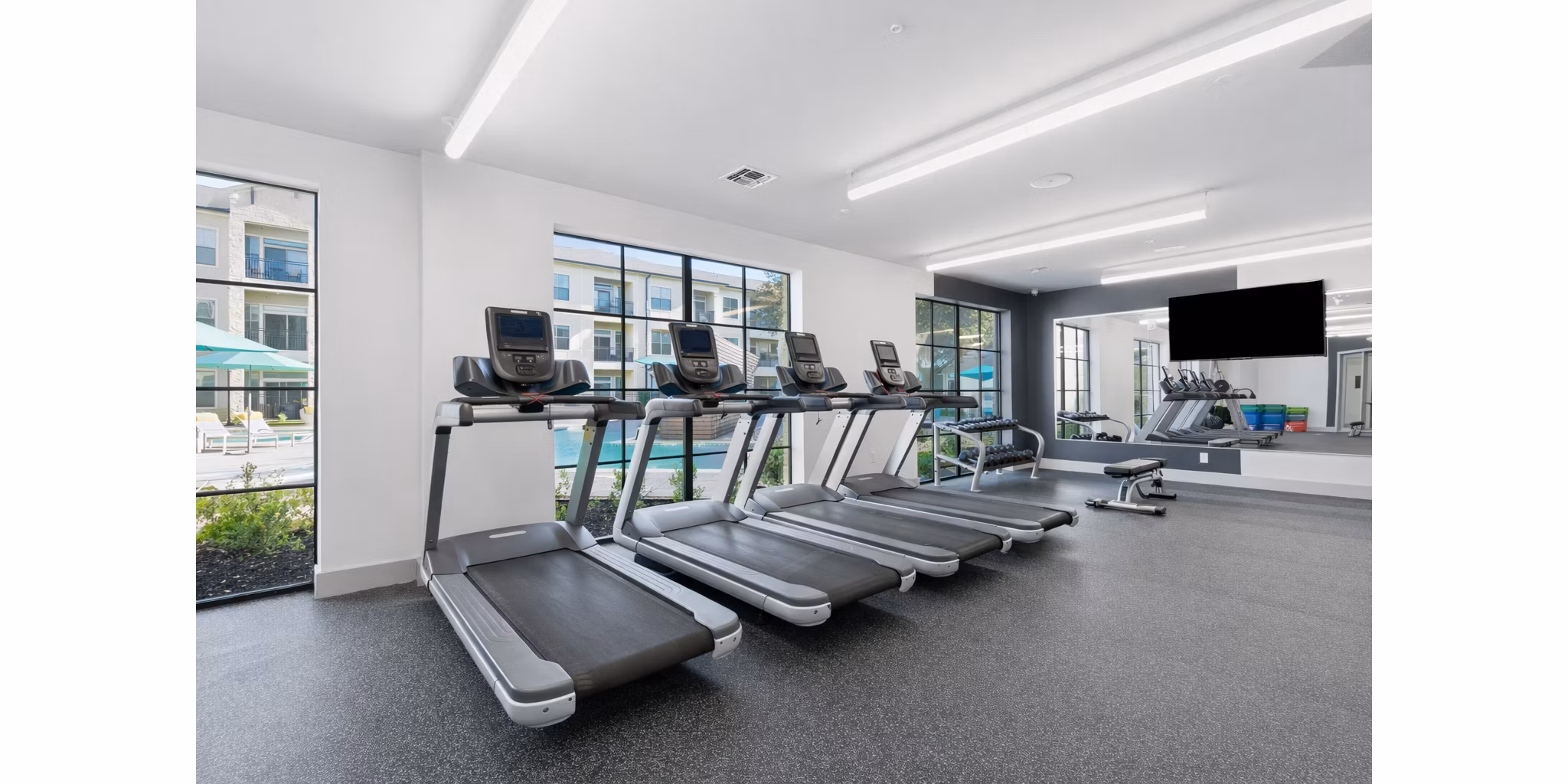 fitness center at The Sterling at Oak Hills Apartments