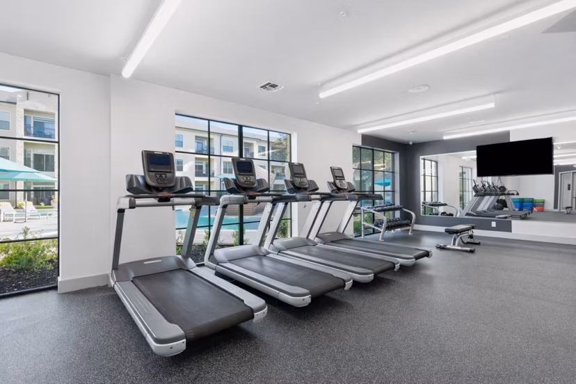 fitness center at The Sterling at Oak Hills Apartments