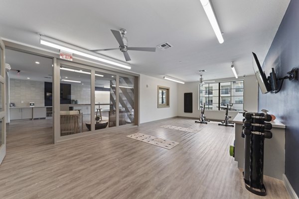 fitness center at The Sterling at Oak Hills Apartments