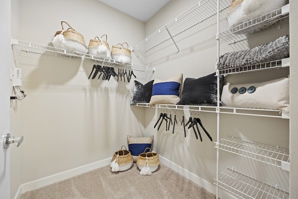 Walk-in closet with ample shelving and storage at Broadstone River House Apartments