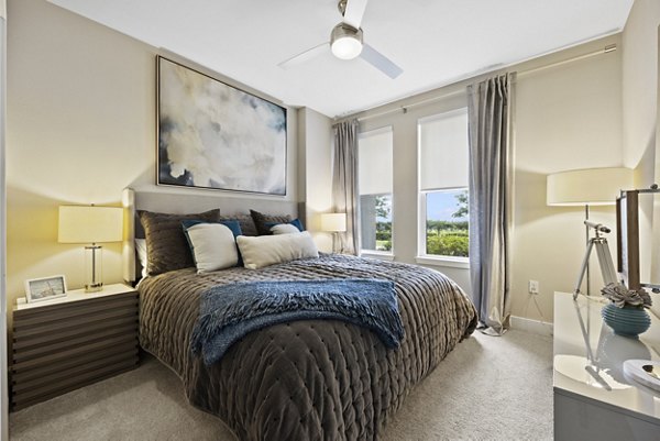 Modern bedroom with river views at Broadstone River House Apartments