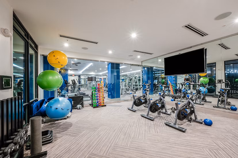Modern fitness center with state-of-the-art equipment at Broadstone River House Apartments