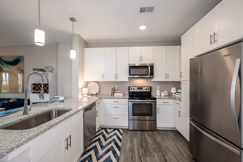 Modern kitchen with sleek stainless steel appliances at Broadstone River House Apartments