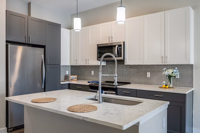 Modern kitchen with stainless steel appliances at Broadstone River House Apartments