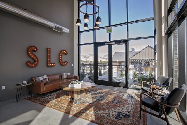 Contemporary clubhouse with modern seating and large windows at Meridian Apartments