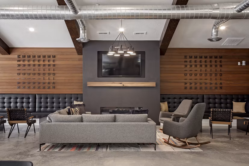 Clubhouse featuring modern design and cozy seating at Meridian Apartments