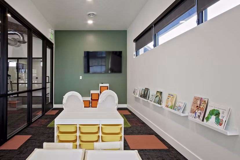 Clubhouse featuring modern seating and vibrant decor at Meridian Apartments