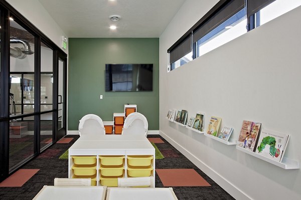Clubhouse featuring modern seating and vibrant decor at Meridian Apartments