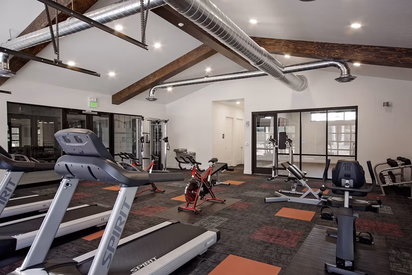 Fitness center with modern equipment at Meridian Apartments