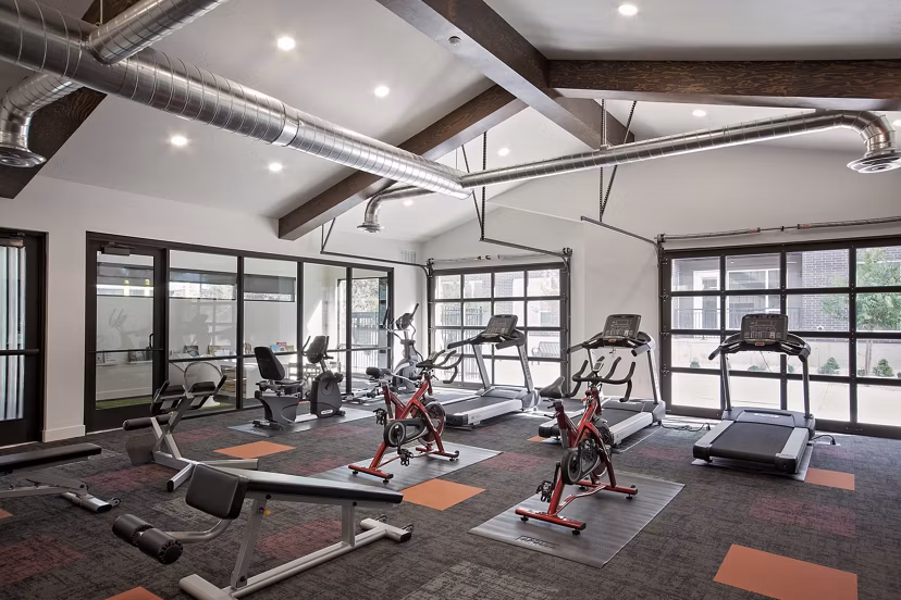 Meridian Apartments: Luxury fitness center with modern equipment and spacious workout area
