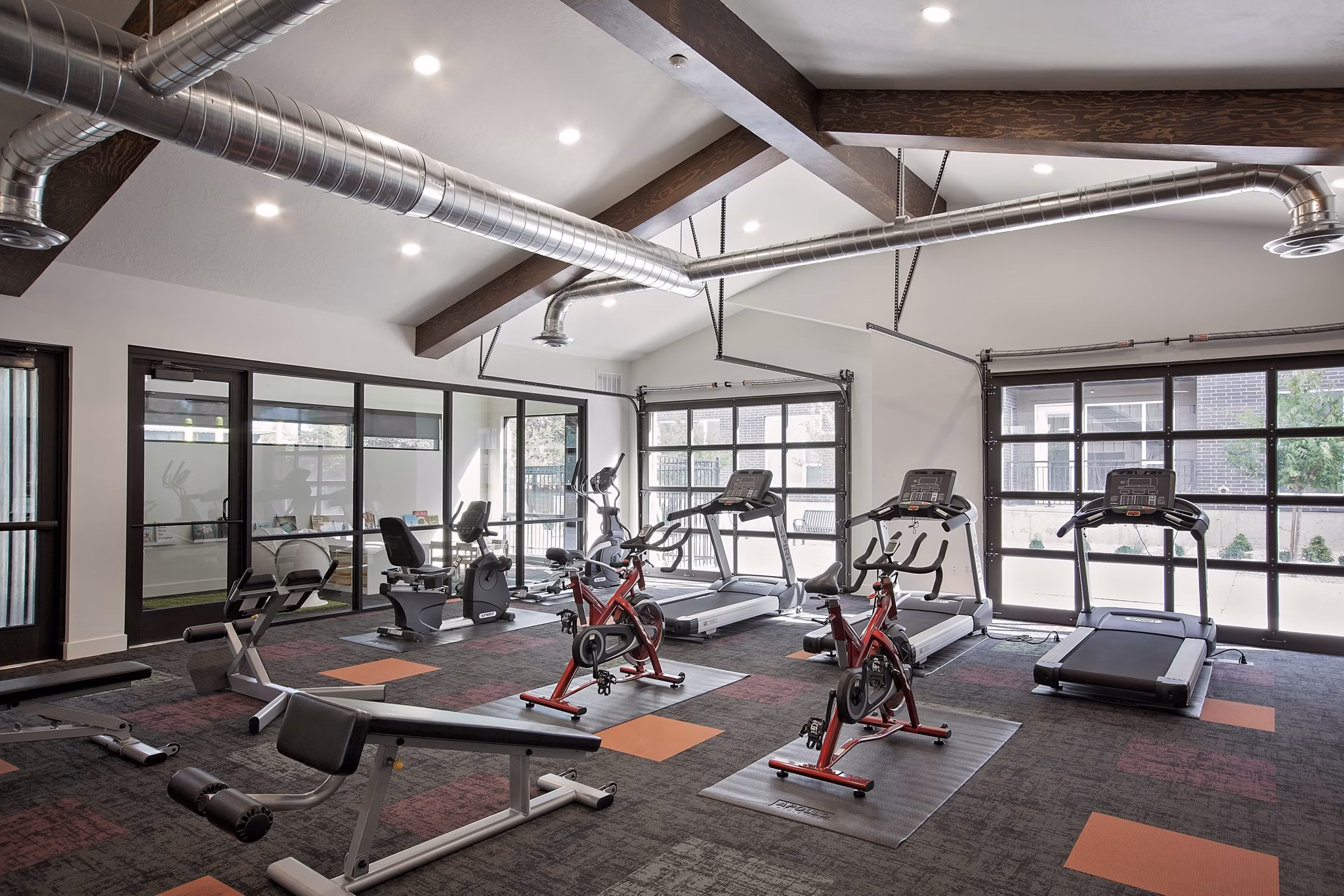 Meridian Apartments: Luxury fitness center with modern equipment and spacious workout area