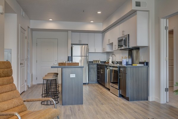 Spacious kitchen featuring modern appliances at Meridian Apartments