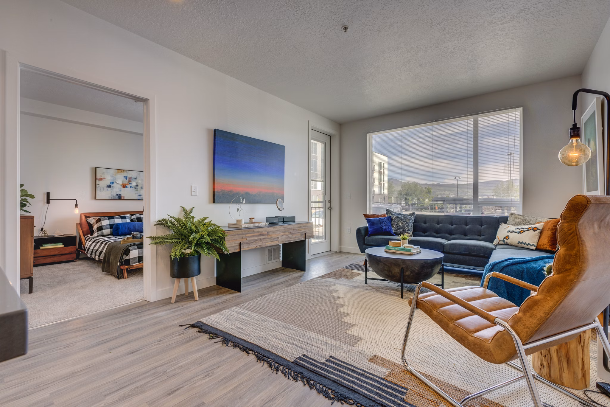 Stylish living room with modern decor and cozy seating at Meridian Apartments
