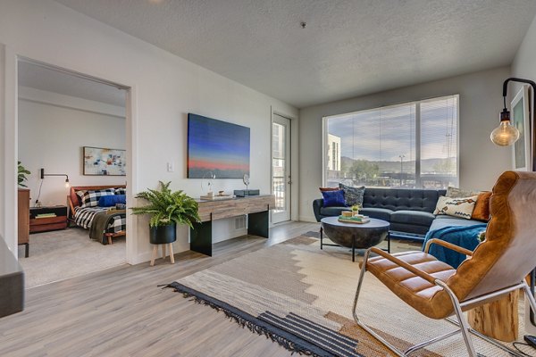 Stylish living room with modern decor and cozy seating at Meridian Apartments