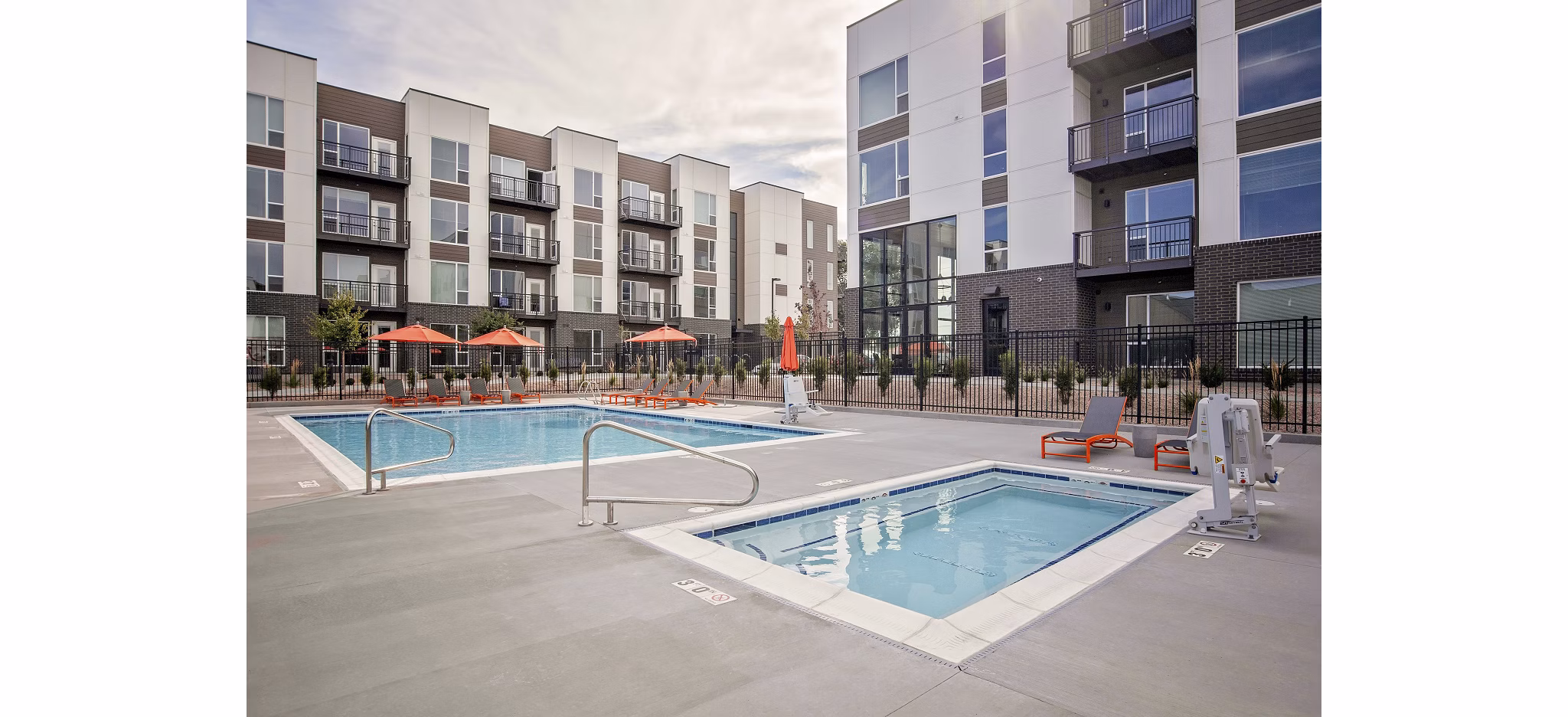 Sparkling pool surrounded by lush landscaping at Meridian Apartments