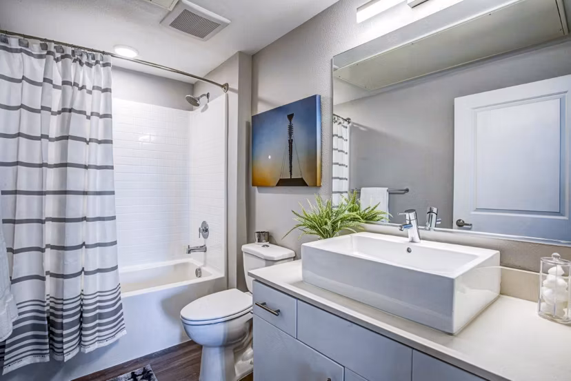 Modern bathroom with sleek fixtures and subway tiles at Inova Apartments