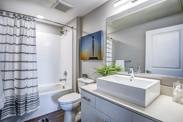 Modern bathroom with sleek fixtures and subway tiles at Inova Apartments