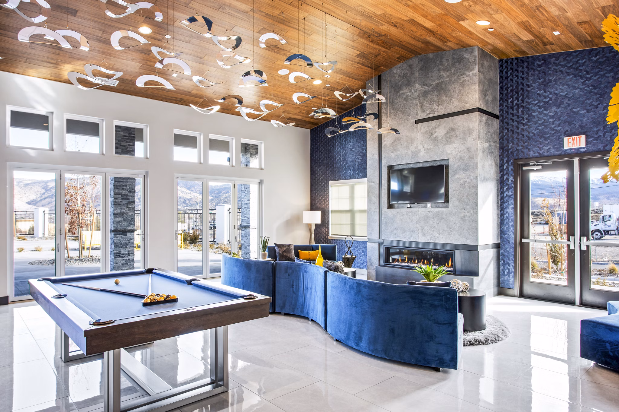 Clubhouse game room with billiards and seating in Inova Apartments, Greystar luxury community