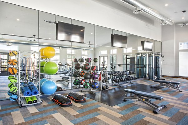 State-of-the-art fitness center with cardio and strength equipment at Inova Apartments: Luxury living by Greystar