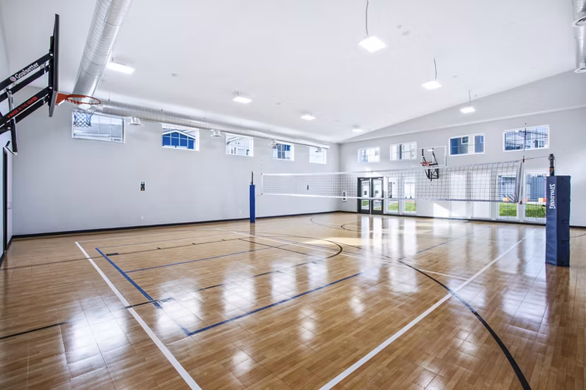 Inova Apartments: Outdoor volleyball court with scenic views, ideal for fitness enthusiasts seeking luxury living at Greystar communities