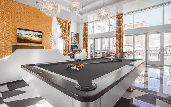 game room at Elysian at the District Apartments 