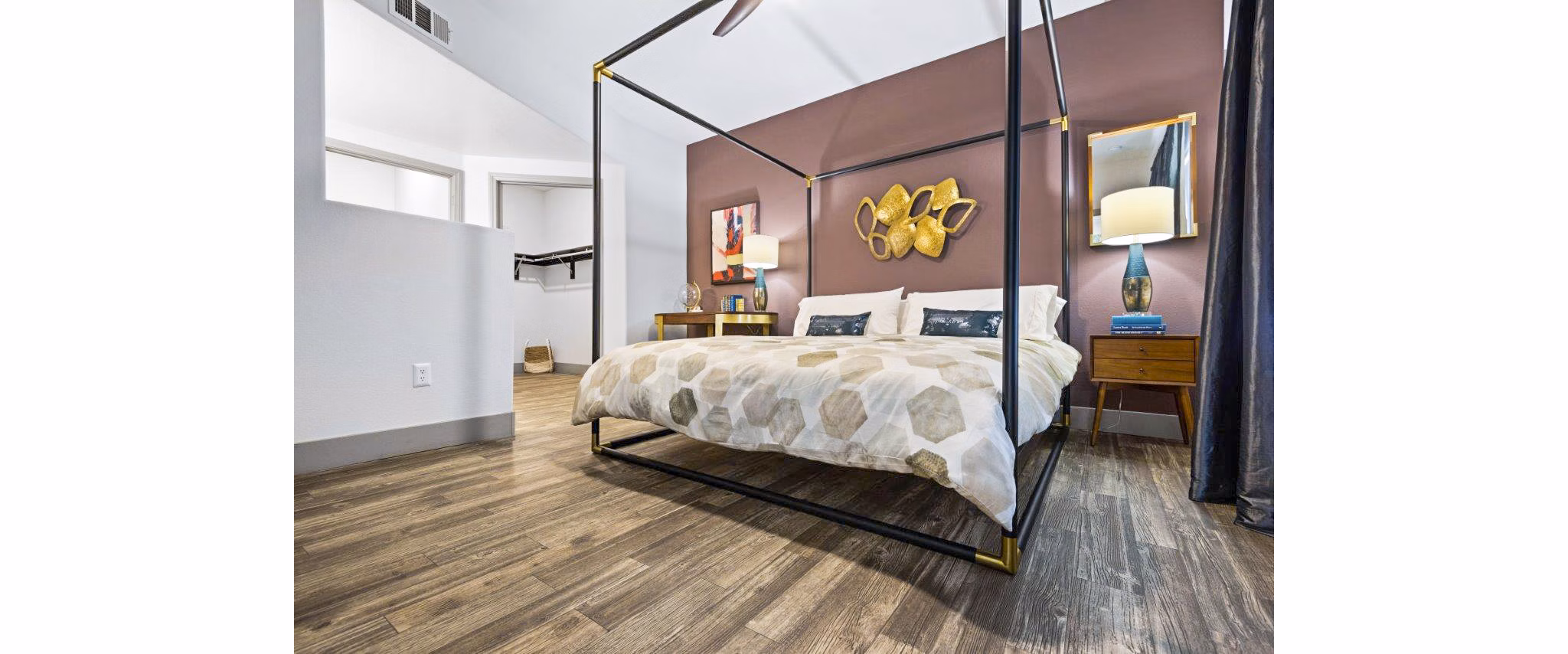 Bedroom featuring stylish decor and ample natural light in Reverb at Spring Valley Apartments