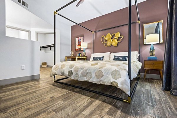 Bedroom featuring stylish decor and ample natural light in Reverb at Spring Valley Apartments