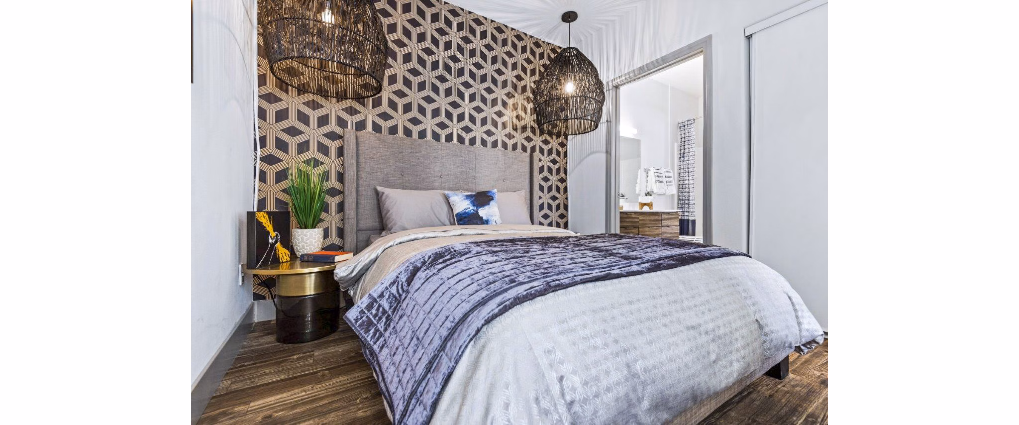 Modern bedroom featuring minimalist design and large windows at Reverb at Spring Valley Apartments, luxury living by Greystar