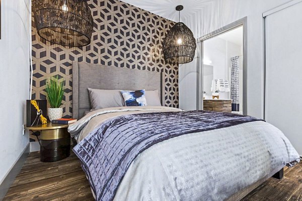 Modern bedroom featuring minimalist design and large windows at Reverb at Spring Valley Apartments, luxury living by Greystar