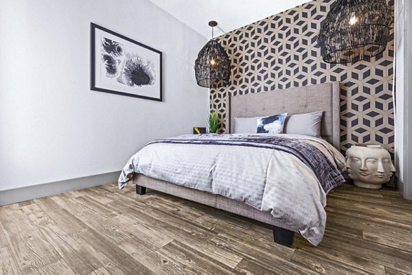 Spacious bedroom with modern furnishings in Reverb at Spring Valley Apartments