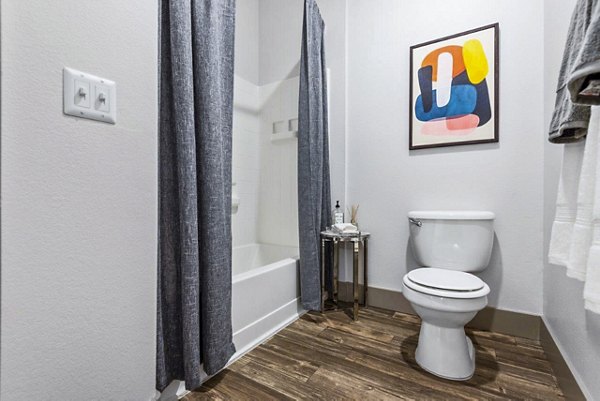 Bathroom featuring sleek countertops and modern fixtures at Reverb at Spring Valley Apartments