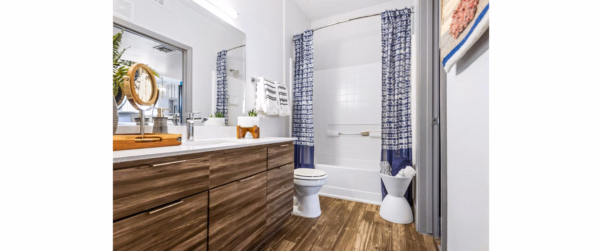 Bathroom with sleek fixtures and modern design at Reverb at Spring Valley Apartments, offering luxurious living spaces in an elegant setting