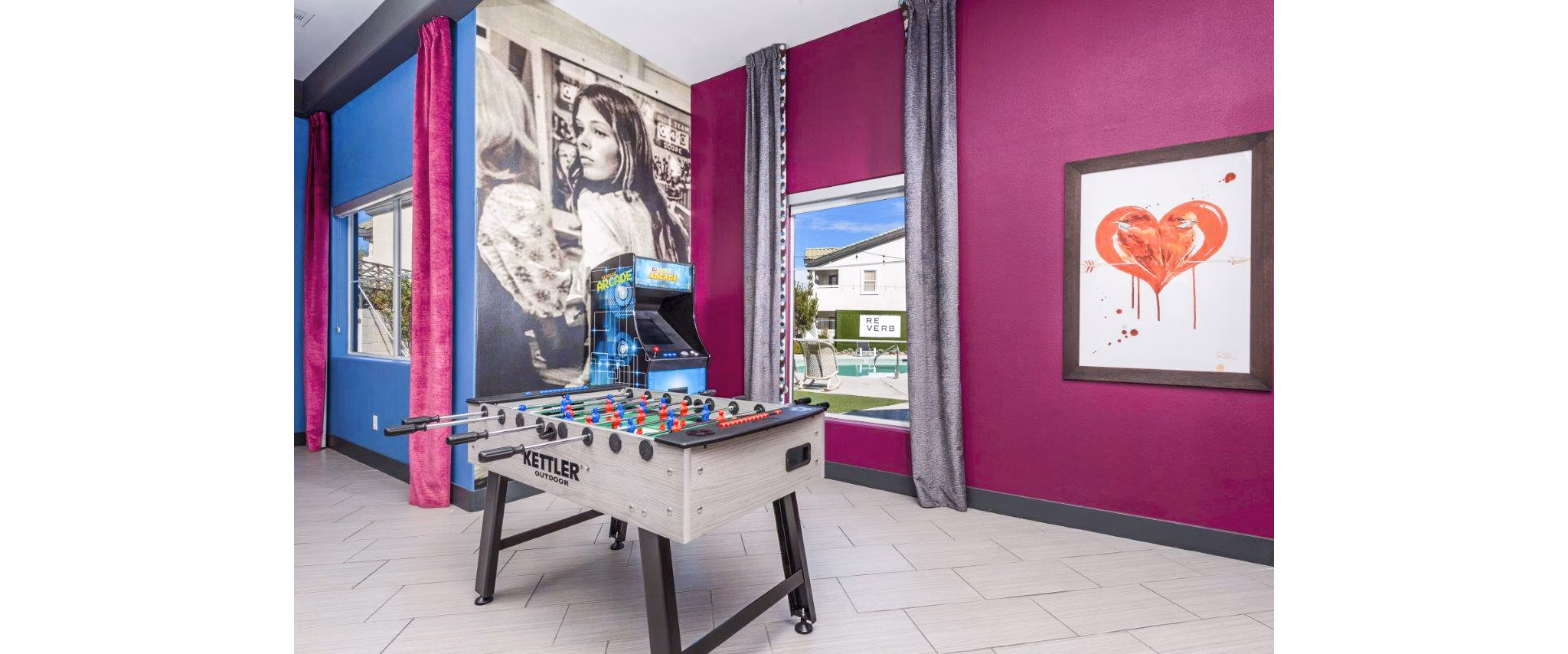 Game room with pool table and lounge area at Reverb, Spring Valley Apartments for leisure and entertainment enthusiasts