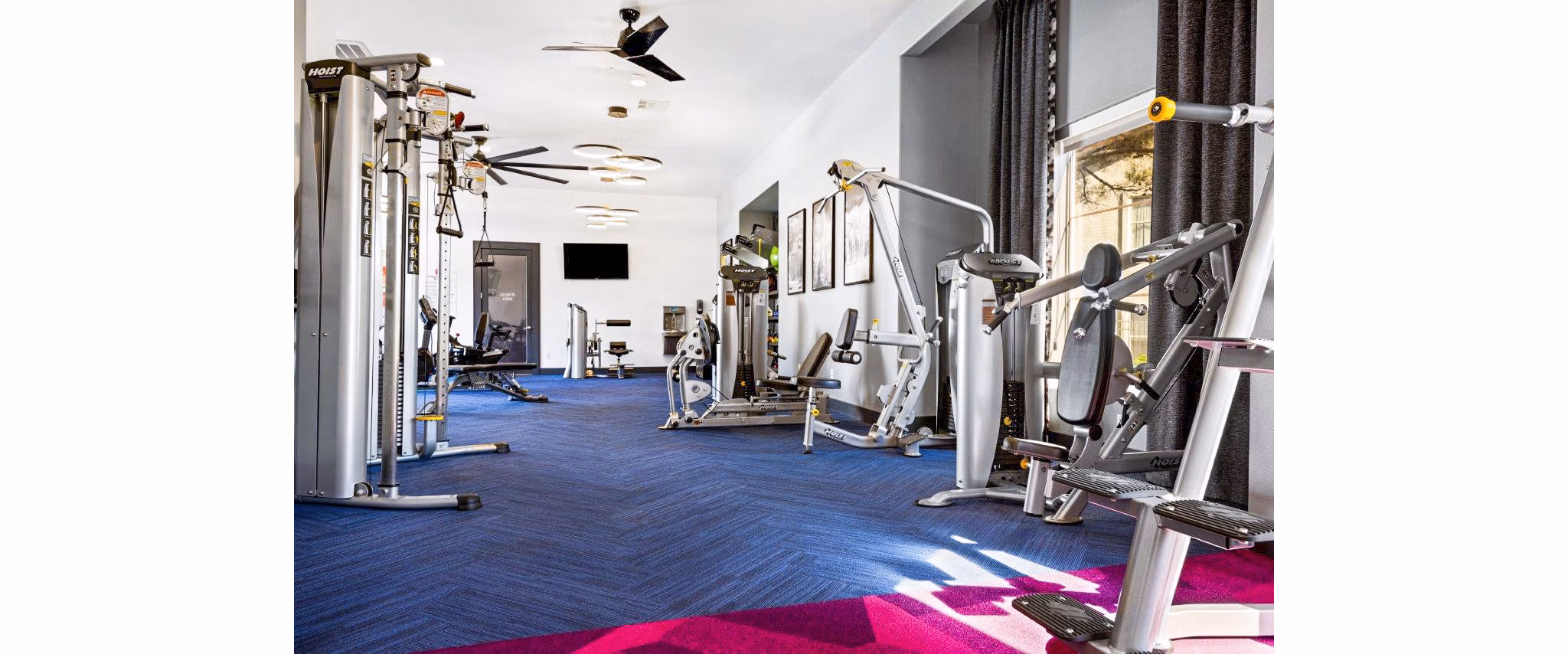 State-of-the-art fitness center with modern equipment at Reverb at Spring Valley Apartments