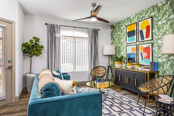 Spacious living room with modern decor and natural light at Reverb at Spring Valley Apartments, ideal for luxury living