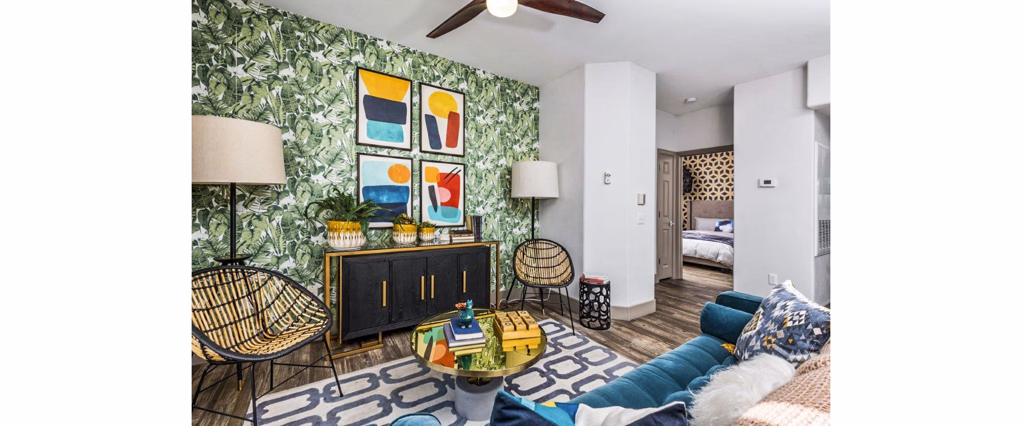 Modern living room featuring plush seating and large windows at Reverb at Spring Valley Apartments