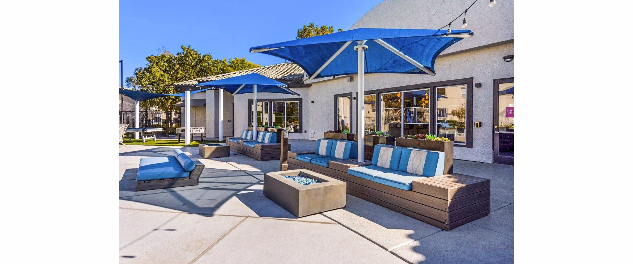 Resort-style pool and patio area at Reverb at Spring Valley Apartments, perfect for relaxation and socializing