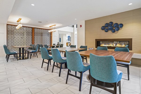 Clubhouse featuring modern design and cozy seating areas at The Ivy at Draper Apartments