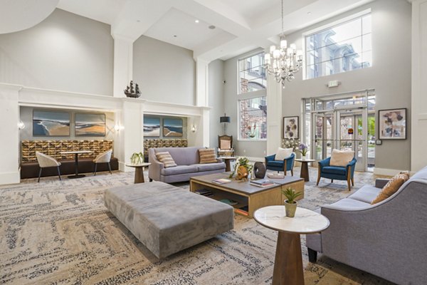 Elegant clubhouse with modern seating and lush decor at The Ivy at Draper Apartments