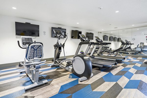 Modern fitness center with state-of-the-art equipment at The Ivy at Draper Apartments