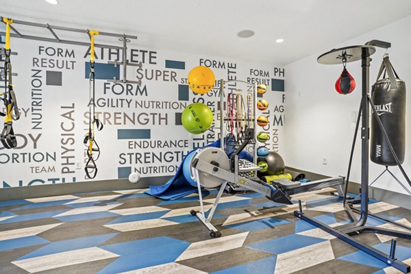 State-of-the-art fitness center with modern equipment at The Ivy at Draper Apartments