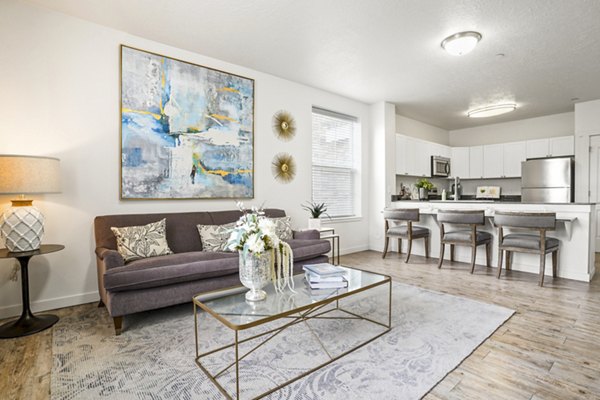 Spacious living room with modern decor at The Ivy at Draper Apartments