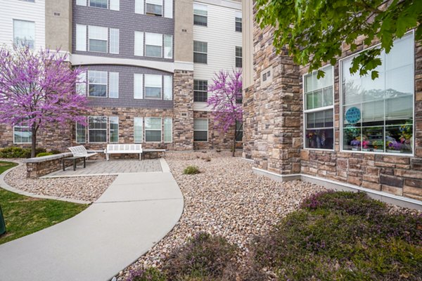 Courtyard with cozy lounge seating at The Ivy at Draper Apartments, ideal for relaxation and community gatherings