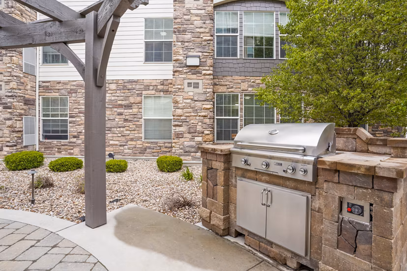 Grill area on a spacious patio at The Ivy at Draper Apartments, perfect for outdoor gatherings and relaxation