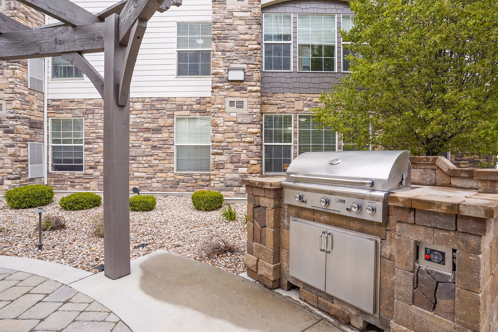 Grill area on a spacious patio at The Ivy at Draper Apartments, perfect for outdoor gatherings and relaxation